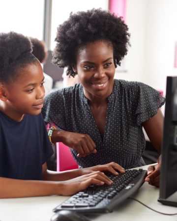 Nigerian teacher giving private lesson to student